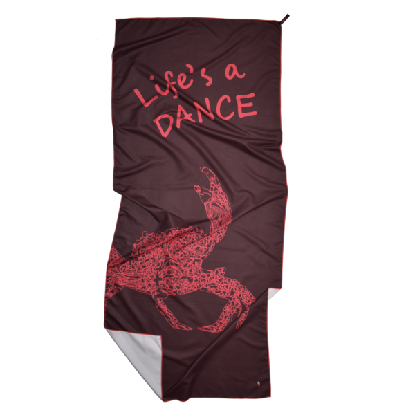 CANYLA XL Microfiber Beach Towel, red, showing text "Life's a DANCE", and the drawing of a dancing crab. Bottom left corner is folded over.